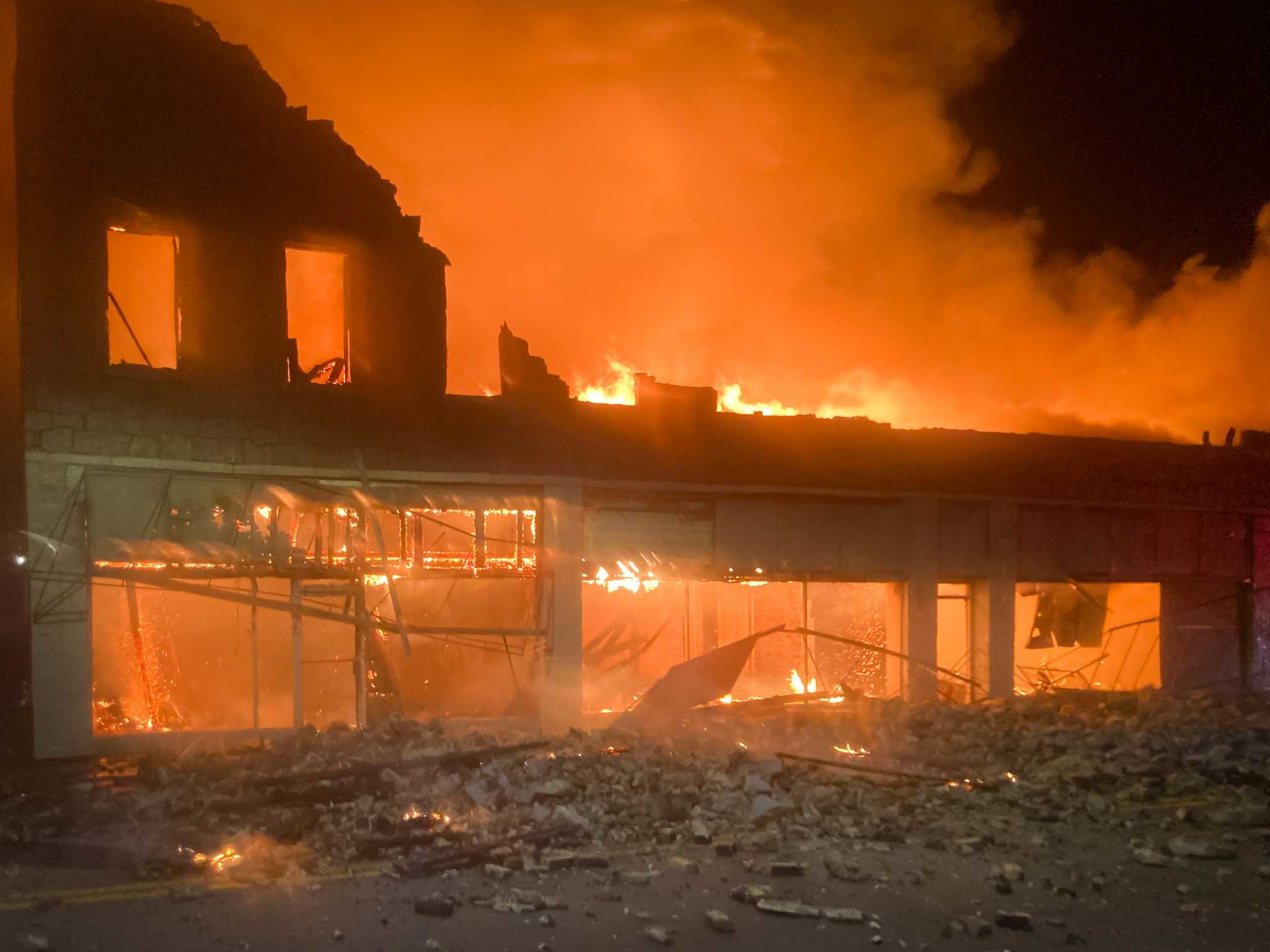 Investigation underway after two-story historic building partially collapses during fire