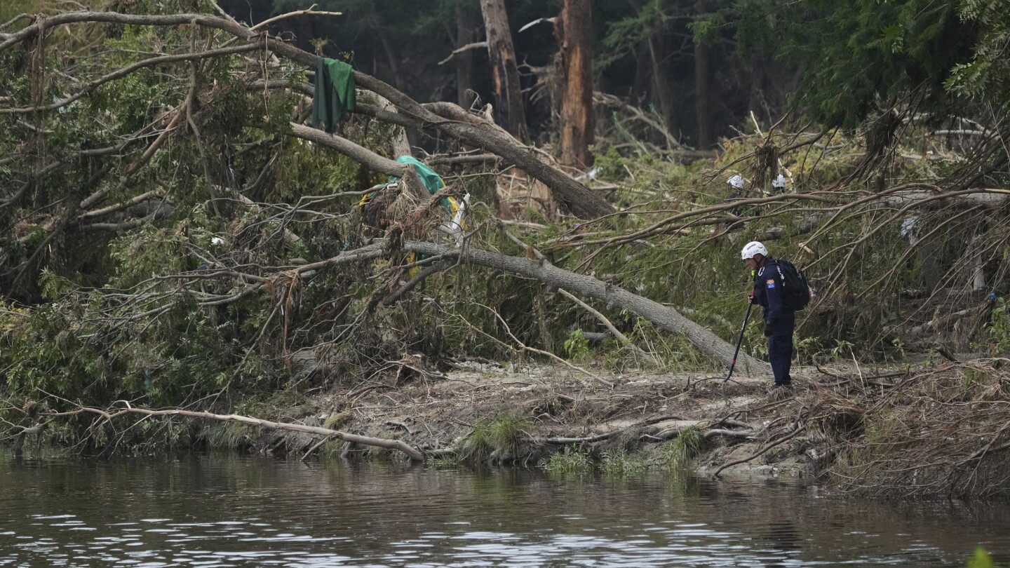Emergency crews suspend search for flooding victims in central Texas amid new flood warnings.