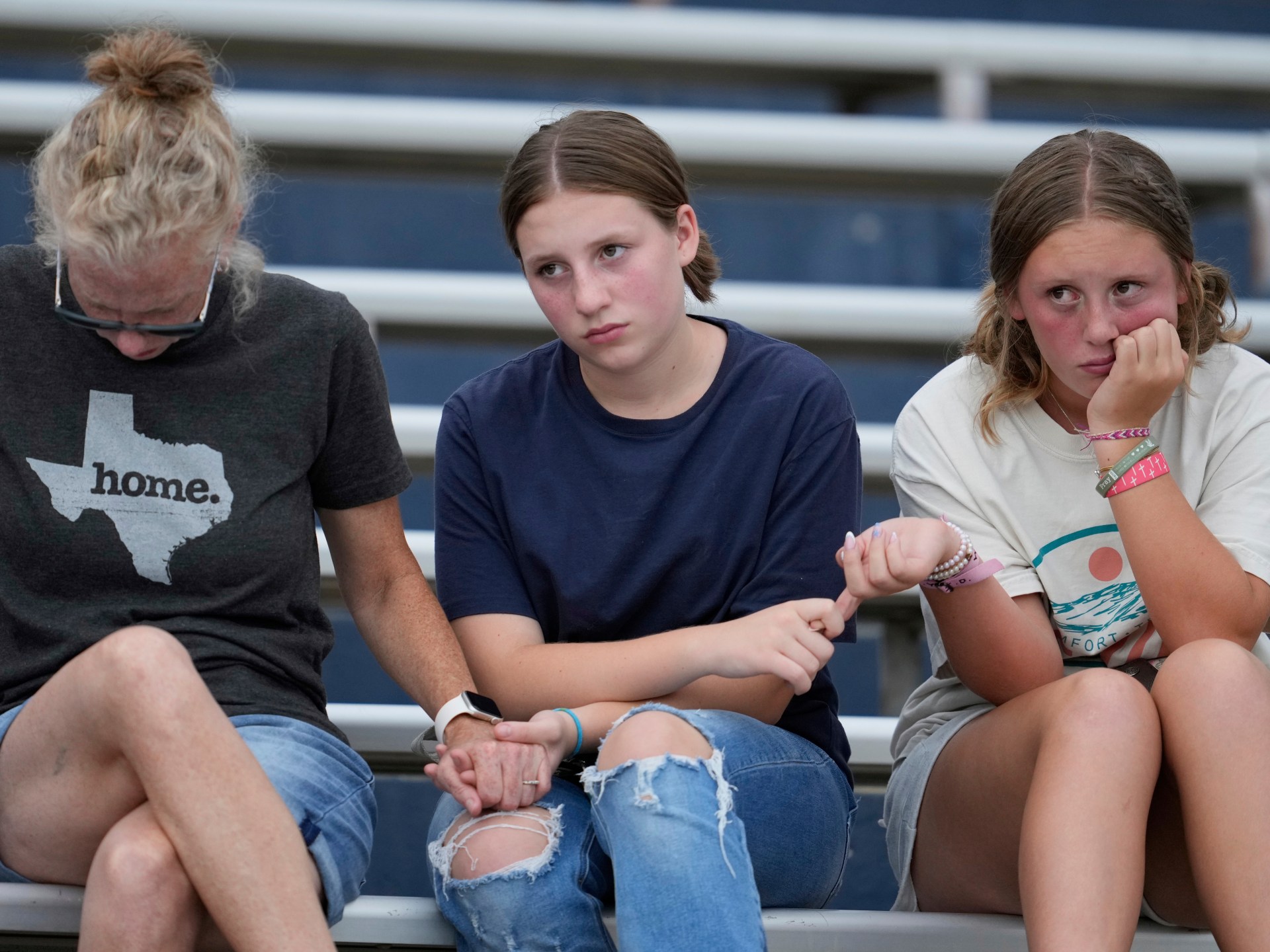 Texas mourns flood victims at vigil as search continues for dozens missing