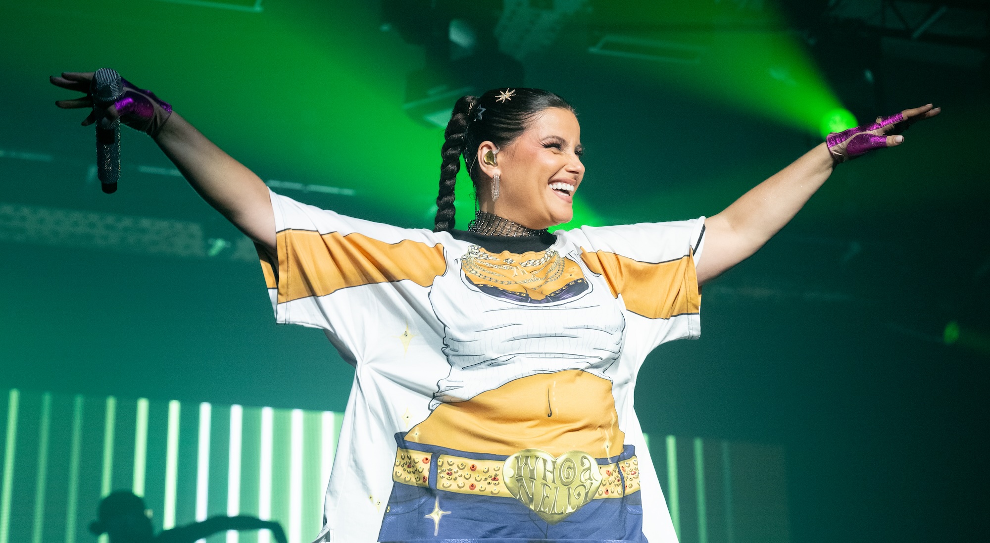 Nelly Furtado Defies Body-Shamers in 'Better Than Ever' T-Shirt on Stage