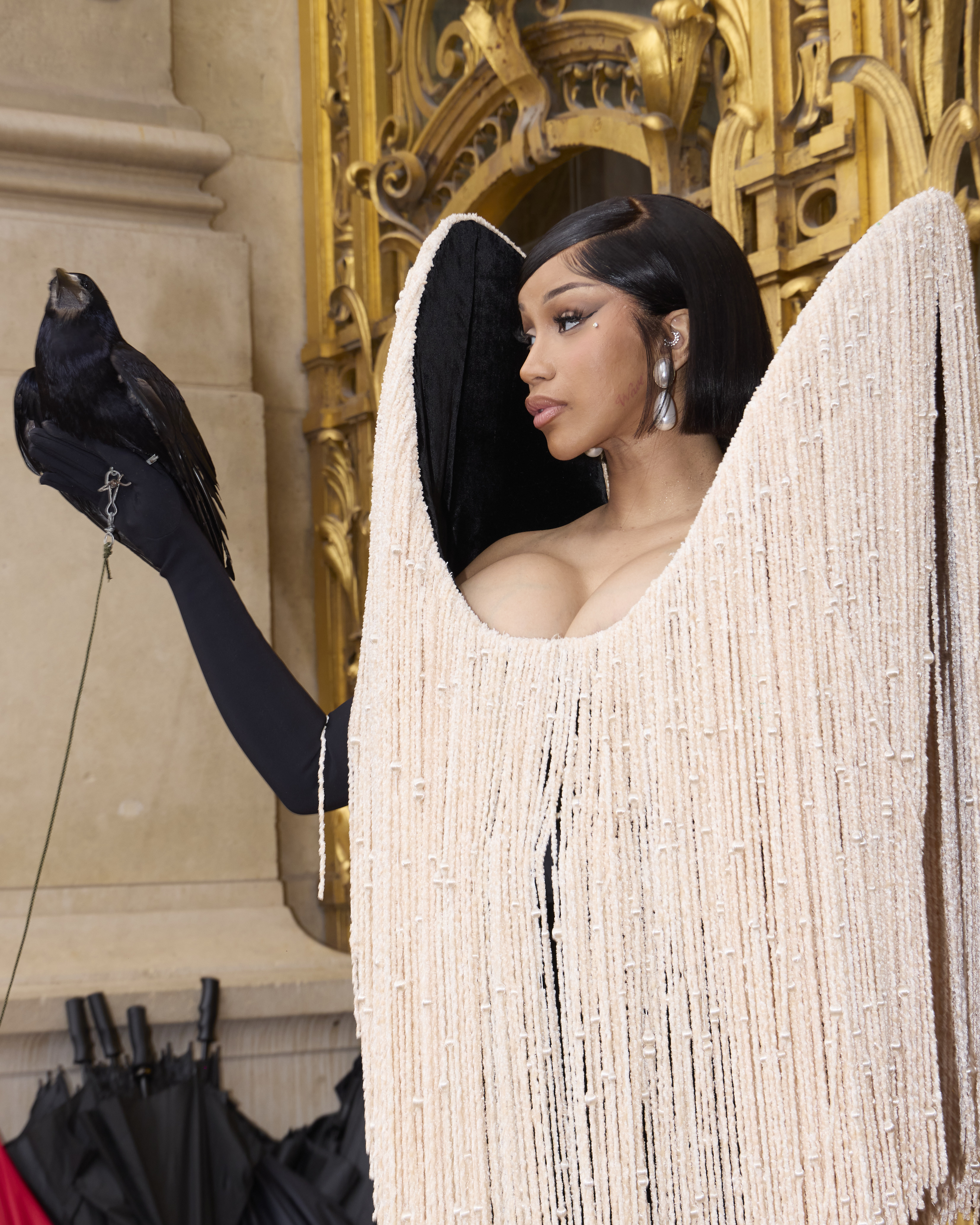Cardi B brings the drama with live bird and fringe dress at Schiaparelli Paris Haute Couture Week show 