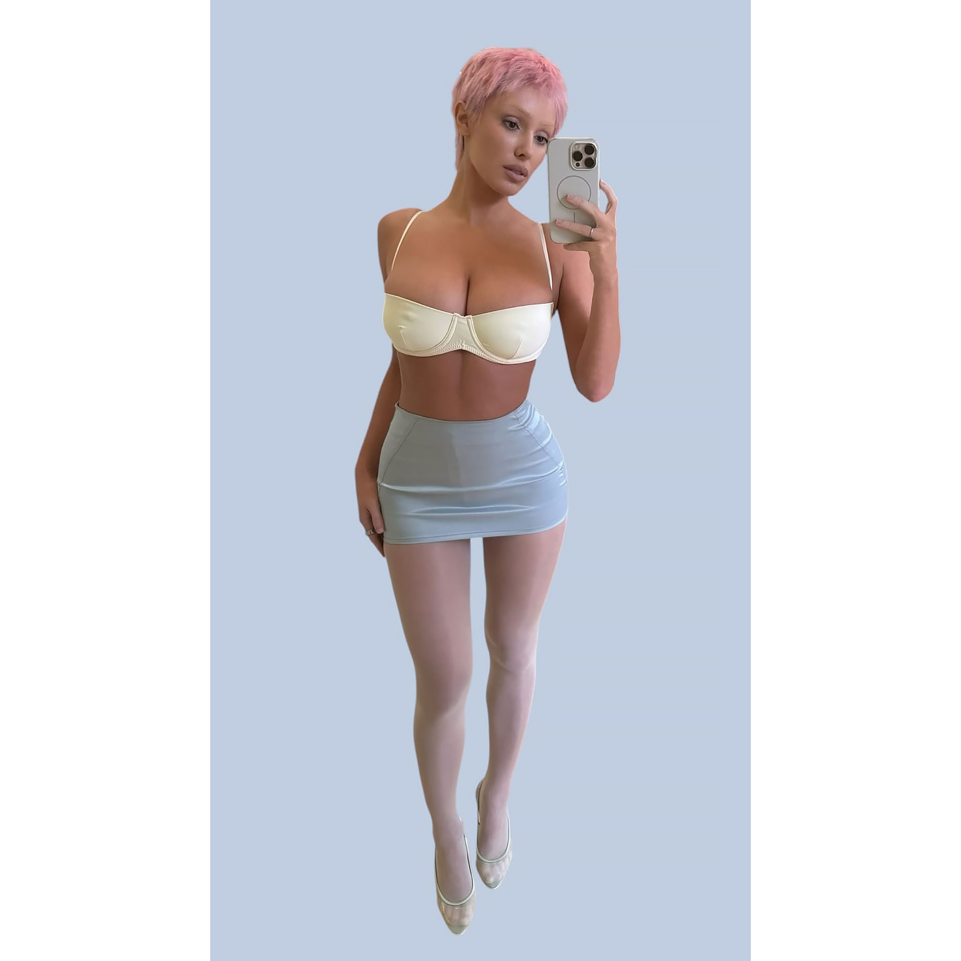 Bianca Censori Debuts Candy-Pink Pixie Hair in a Crop Top and Micro Skirt